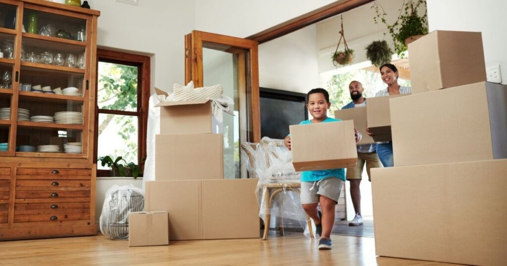 Family with moving boxes