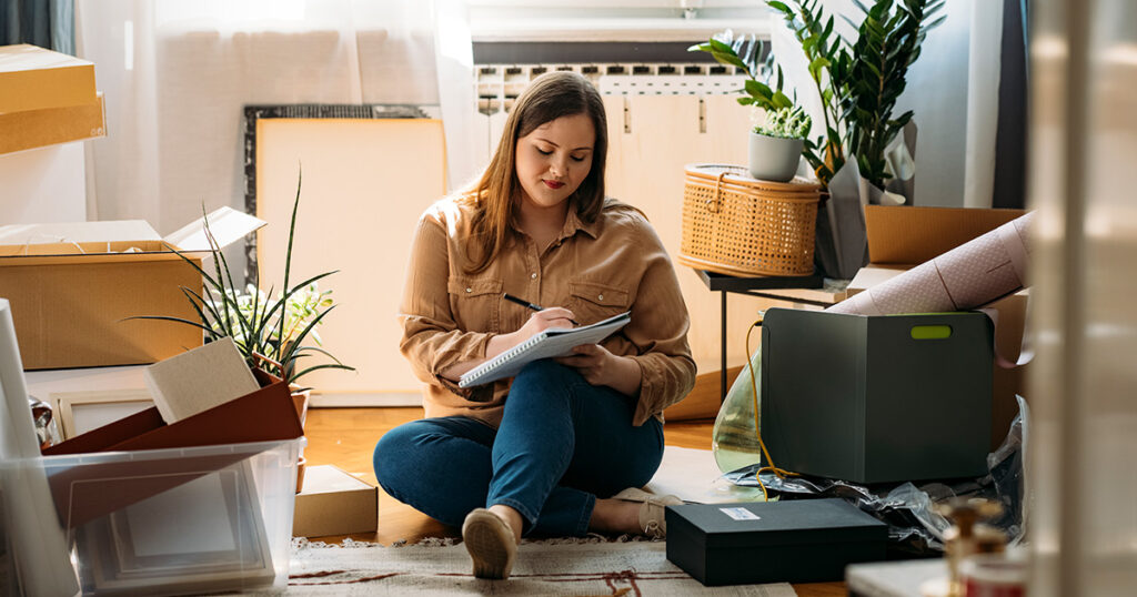 woman making a moving checklist