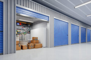 Open storage unit with boxes, tools, and bins.