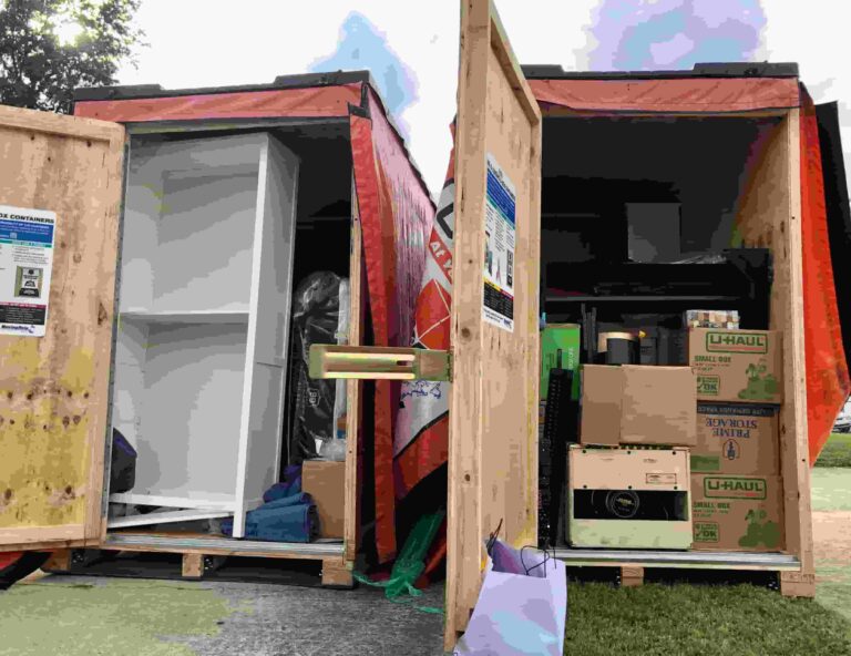 Two U-Box moving containers sitting next to each other with the doors open showing the contents inside