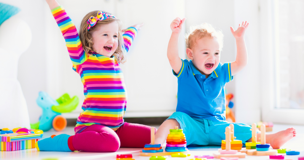 Happy kids playing with toys