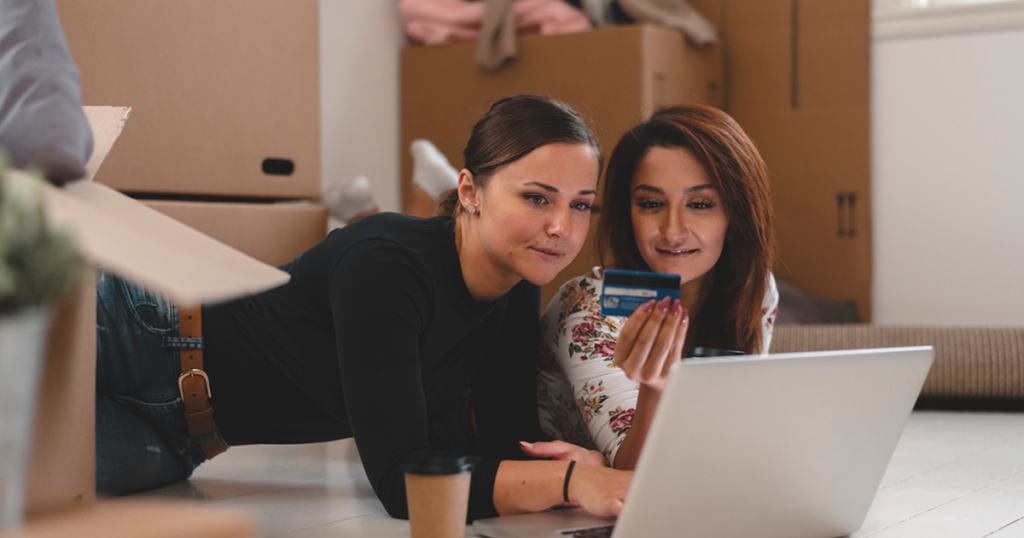 Women setting up utilities online